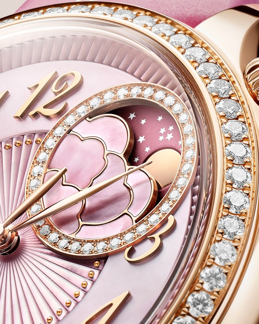 Egerie Moon Phase Spring Blossom watch highlighting the pink dial and diamond-set bezel.