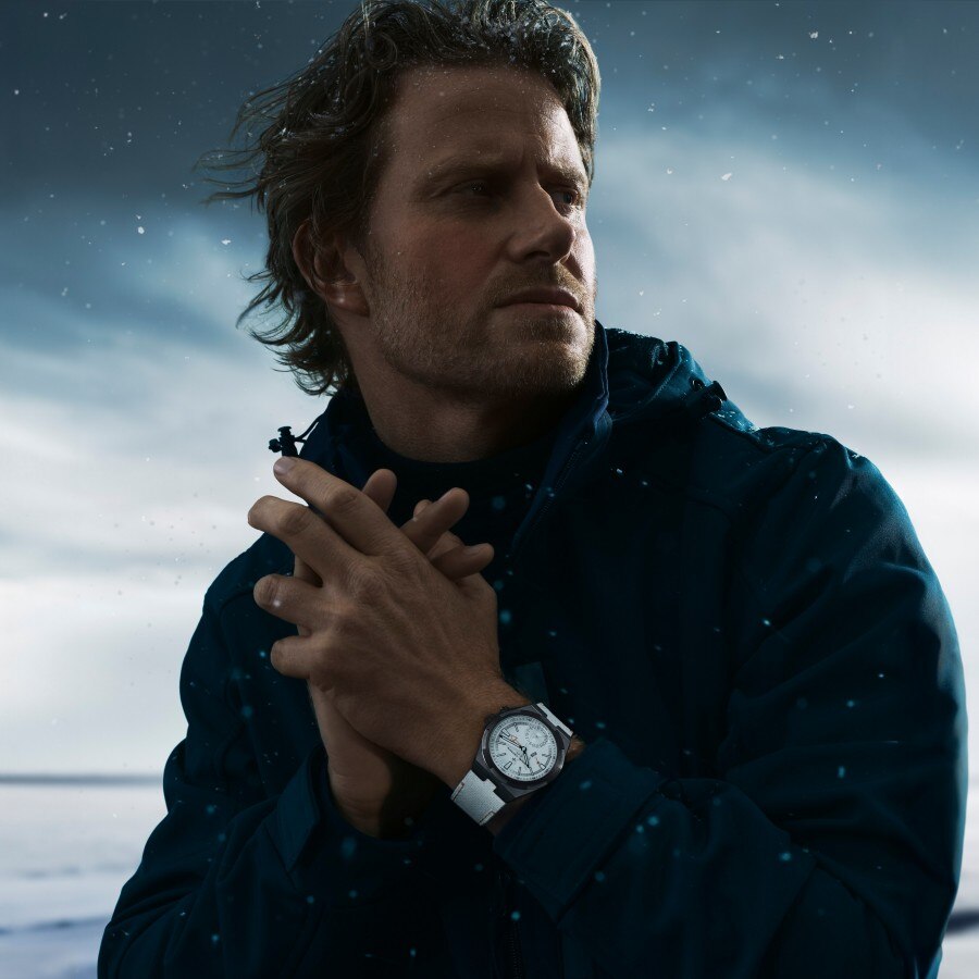 Cory Richards wearing the white Overseas Dual Time Cardinal Points watch with a snowy background