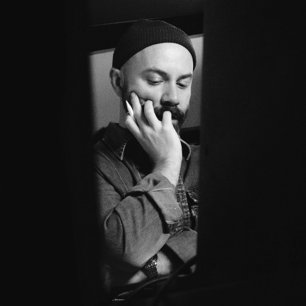 Black and white portrait of Woodkid.