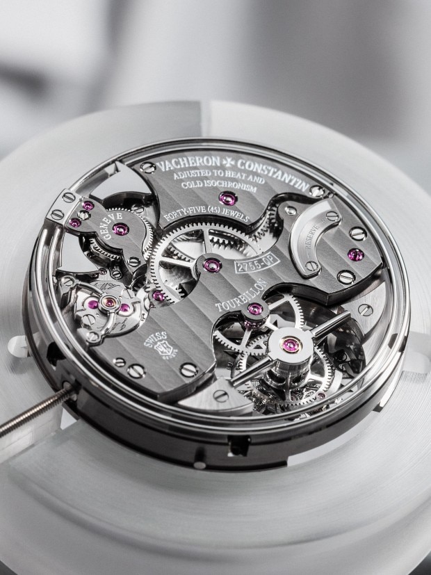 Vacheron Constantin watch movement with visible gears and jewels.