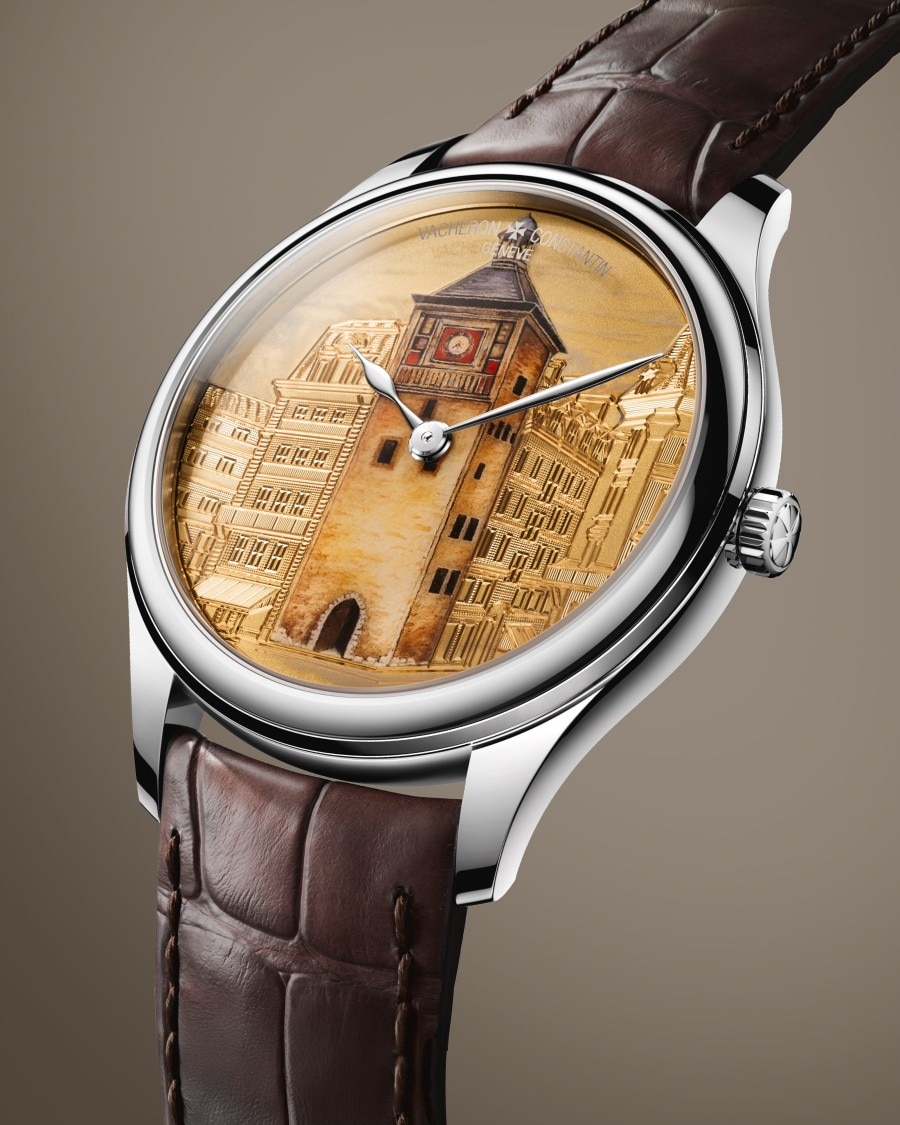Cabinotiers - Tribute to Tour de l'Île An elegant wristwatch with a brown leather strap, silver case, and an engraved architectural design on the dial.