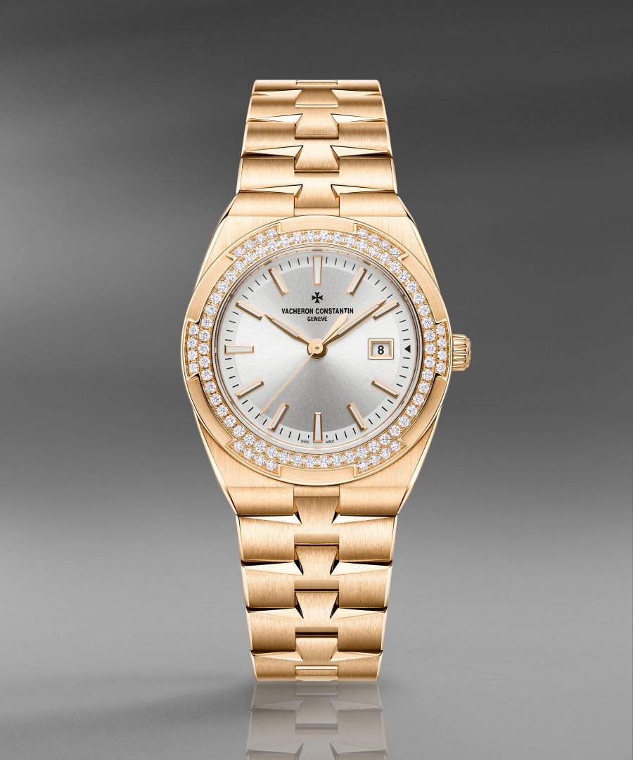 Overseas quartz Luxury watch with a gold braclet and silver-toned dial.