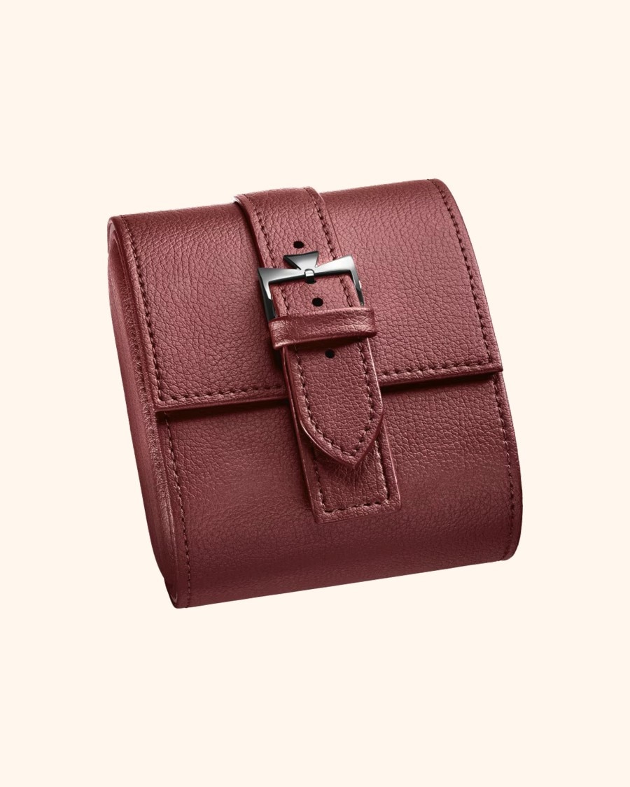 Red watch pouch on a beige background