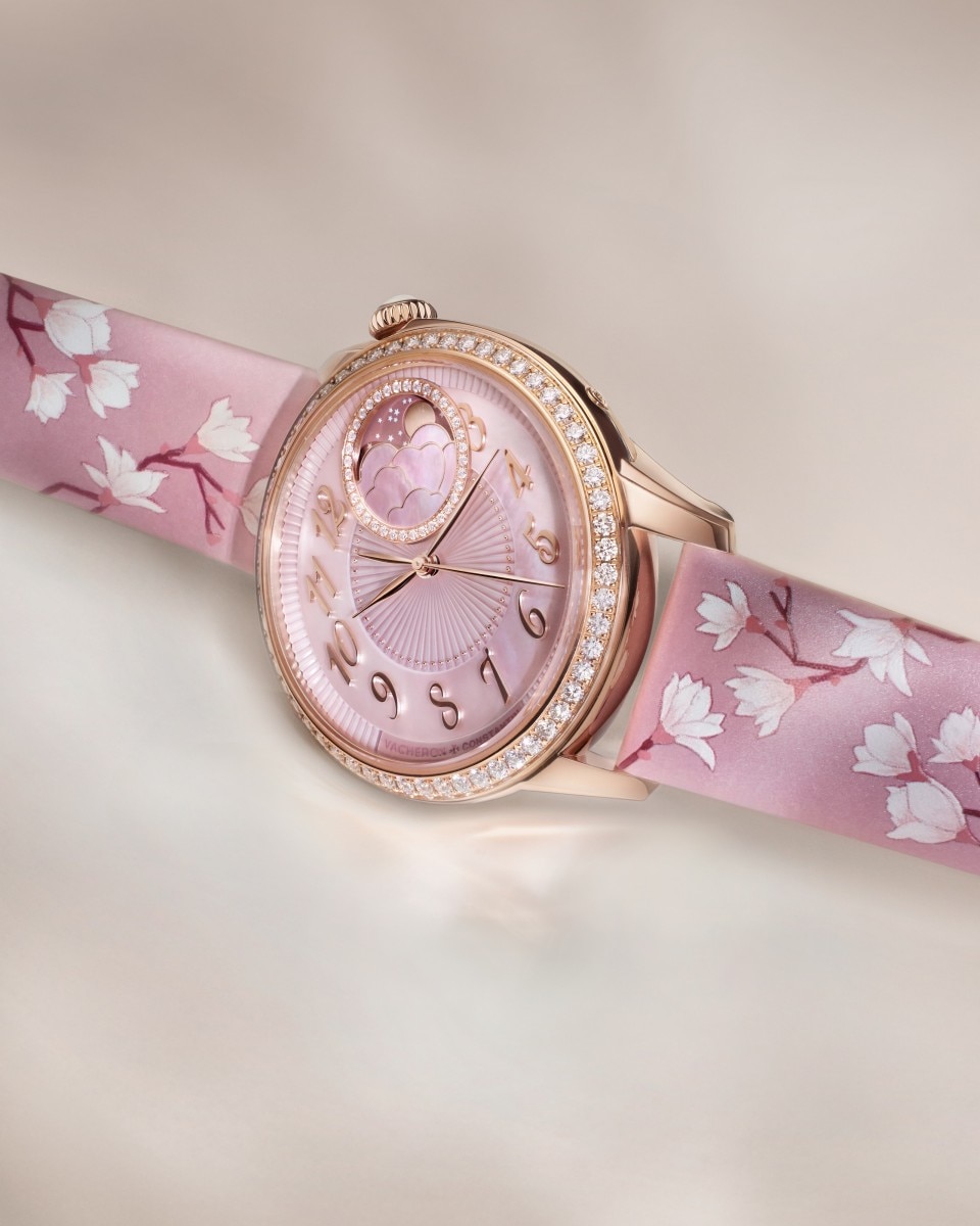 Egerie Moon Phase Spring Blossom watch with floral motifs placed on a light background.