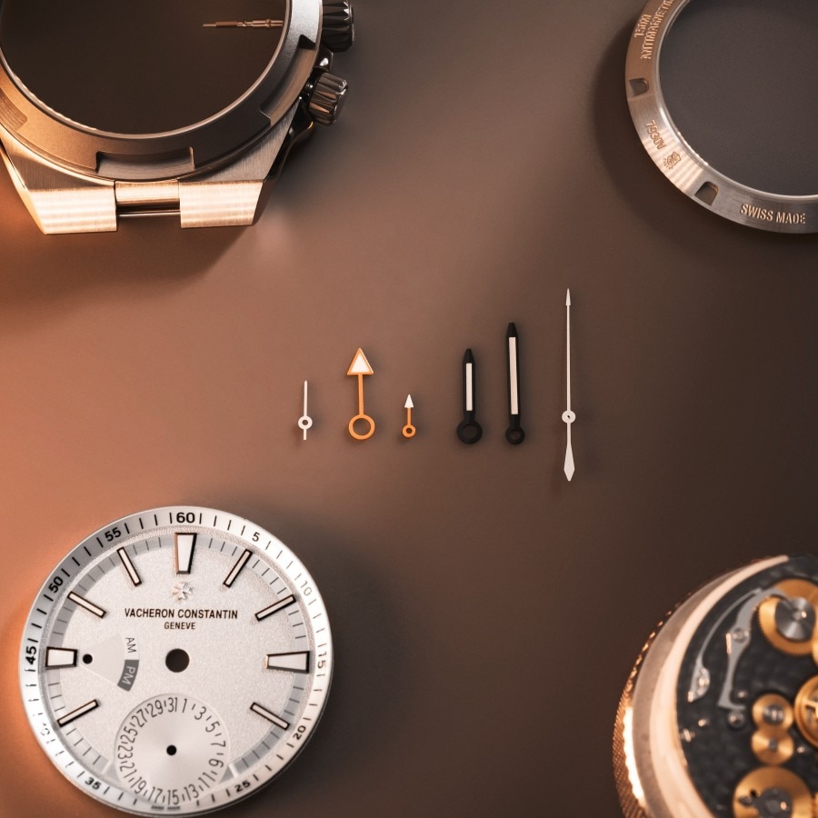 Watch components placed on a dark background.