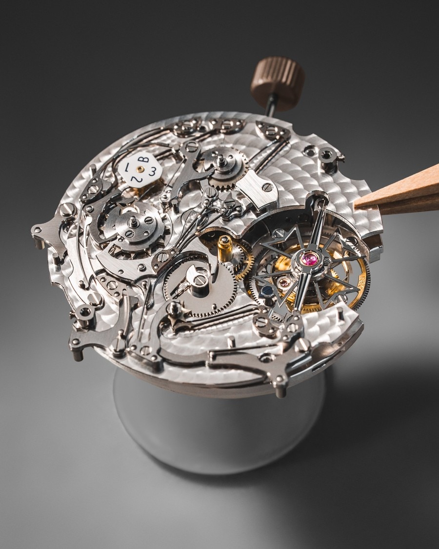 Close-up of an intricate mechanical watch mevement in assembly.