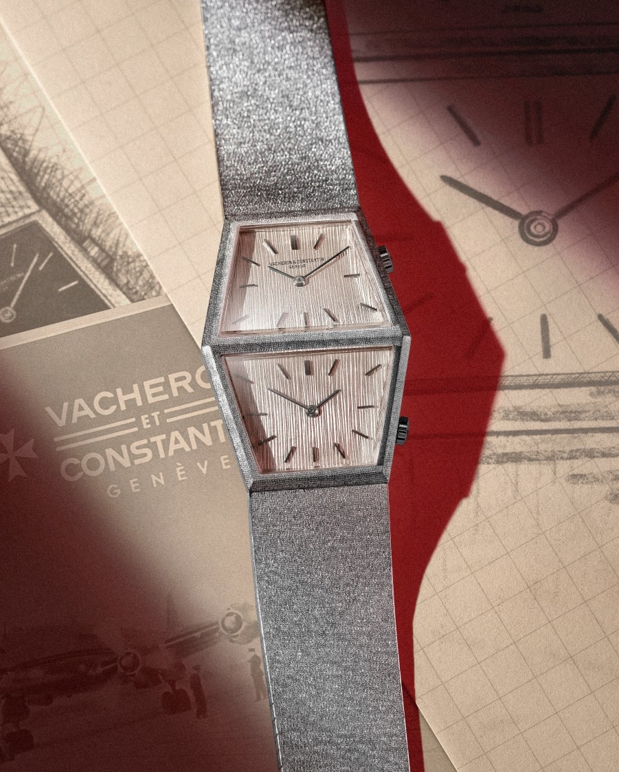 Dual time grey gold watch with a trapeze shaped dial