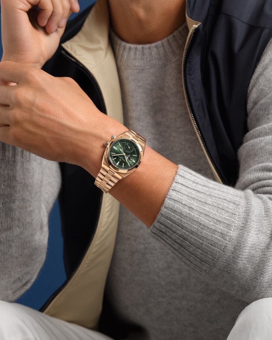  Man wearing a Vacheron Constantin watch with blue dial and silver strap.