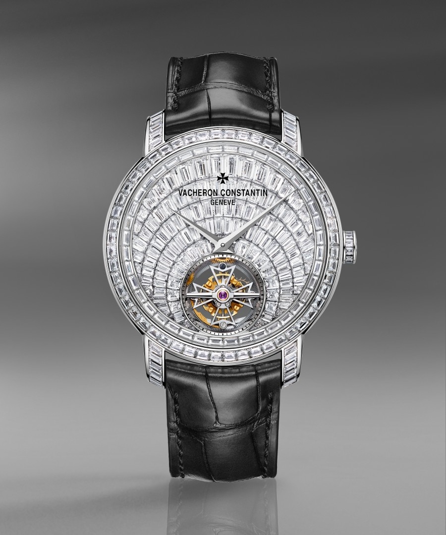 Traditionnelle tourbillon high jewellery High-jewelry watch with a diamond-set case, black leather strap, and visible tourbillon on the dial.