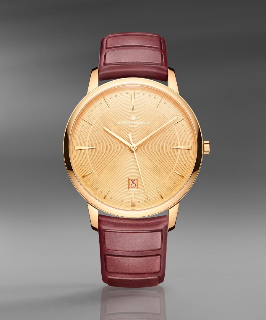 Patrimony self-winding Luxury watch with a gold case, yellow dial, and burgundy leather strap.