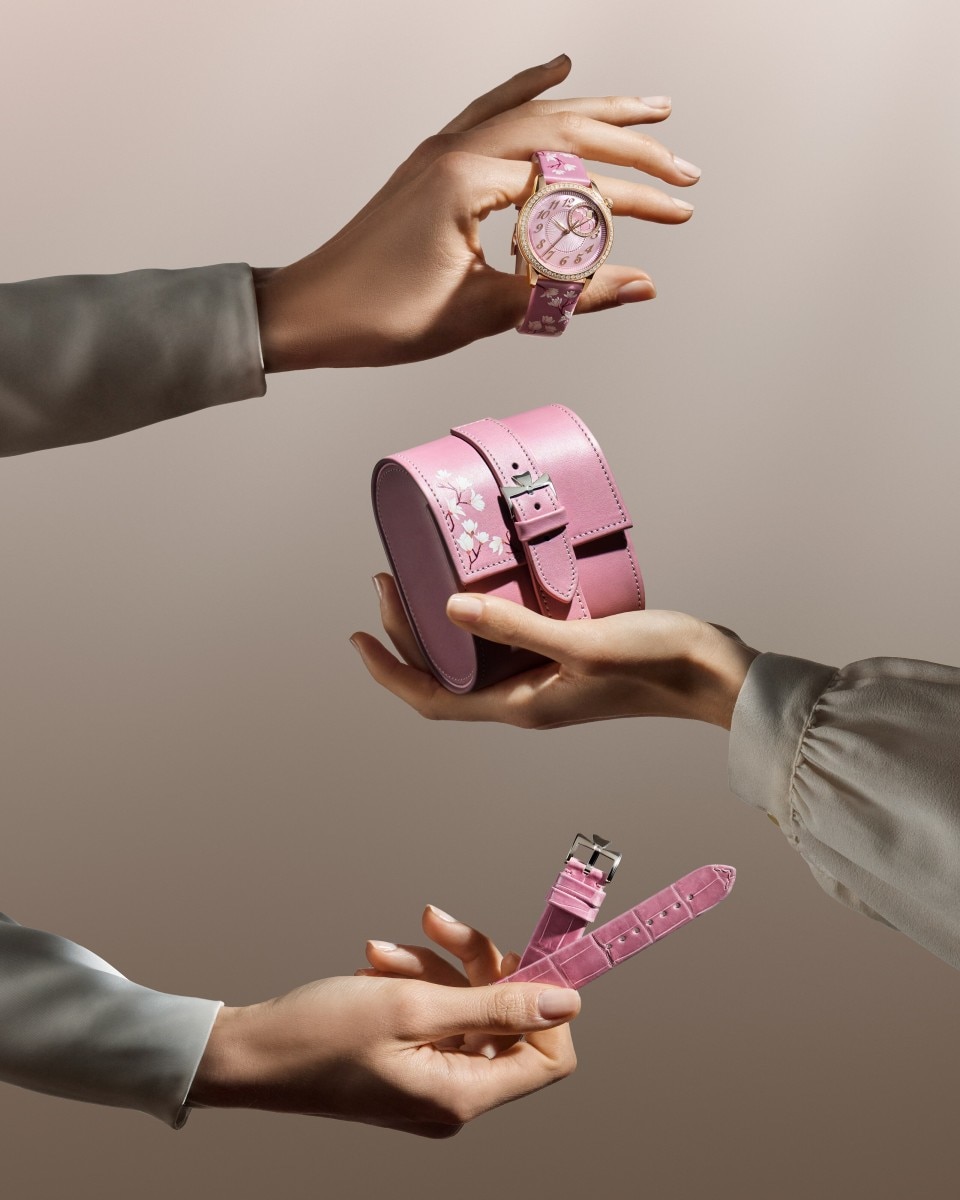 Egerie Moon Phase Spring Blossom watch with floral motifs and a pink storage box.