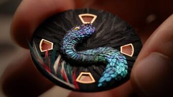 Artist working on the featherwork concept watch.