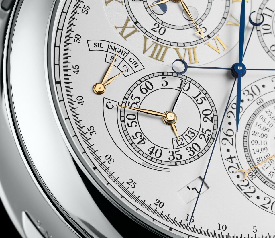 Close-up of the reference 57260 watch with multiple subdials, gold markers, and blue hands.