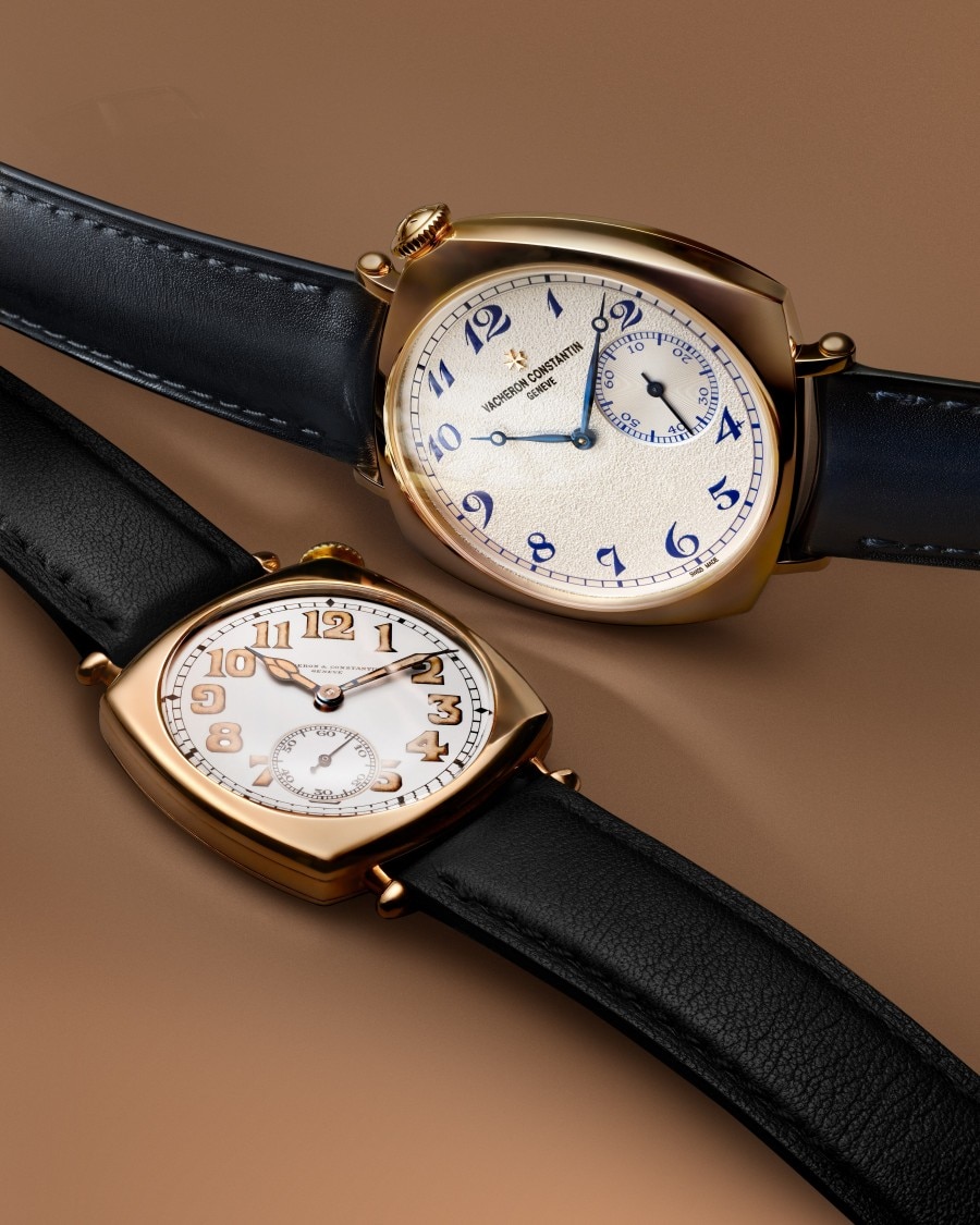 Two vintage-style Historiques American 1921 wristwatches with round and tonneau-shaped cases displayed on dark straps.