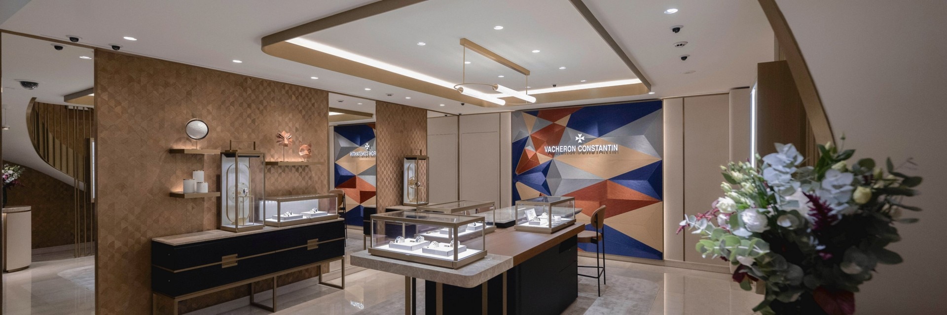 Luxury Vacheron Constantin boutique interior with display cases and modern décor.