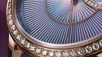 Close-up of the Egerie watch dial showing the delicate texture and diamond detailing.