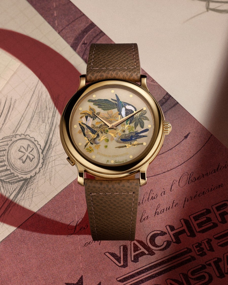 A watch showcasing American birds on its dial