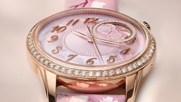 Vacheron Constantin Egerie Moon Phase Spring Blossom watch on a wrist with a pink strap and rose-gold case.