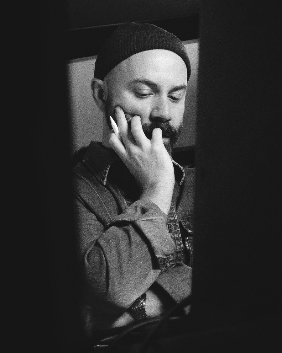 Black and white portrait of Woodkid.