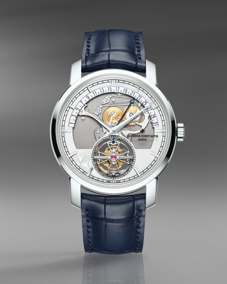 Traditionnelle Tourbillon Retrograde Date Openface Luxury watch with an exposed tourbillon, intricate movement, and a blue leather strap.